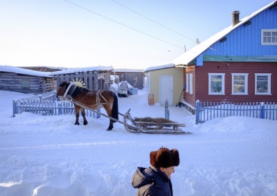 Sovpolie village, Mezen district.  On the main road stop a horse tied to a sled whose bases are attached pieces of dural, material recovered from a rocket debris. This material allows sledges in these villages to slide better on ice and snow.